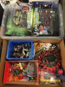 Two boxes of assorted toys including He-Man etc.