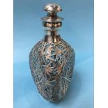 A Dimple Whiskey decanter, overlaid with Oriental silver, 23cm high