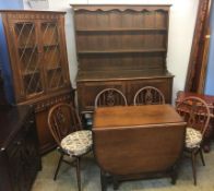 Oak dresser, gateleg table, four Windsor chairs and a corner cabinet