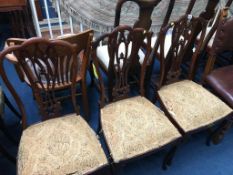 Three mahogany single chairs by Jas. Shoolbred and Co. of London, numbered D8276