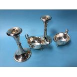 Pair of silver sauce boats (299g) and a pair of weighted silver candlesticks