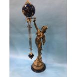 A spelter mystery clock, 82cm high