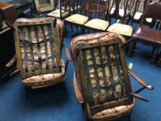 Pair of Ercol armchairs and a pair of Ercol footstools (frames only)