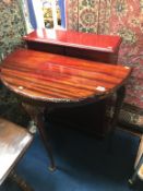 Small cabinet and a half moon table