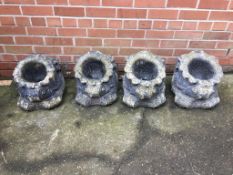 Set of four composite stone garden planters