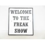 Cast iron freak show sign