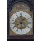 18th Century long case clock in a carved oak case,