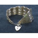 9ct gold gate bracelet with safety chain and heart