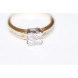 18ct Diamond ring set with four Princess cut diamo