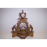 19th Century gilt 8 day mantle clock with blue ena