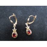 Pair of 9ct Gold earrings set with garnets