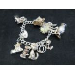 Silver charm bracelet, 12 charms