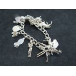 Silver charm bracelet, 11 charms