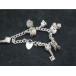Silver charm bracelet with 7 charms