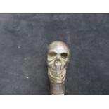 Metal walking stick handle in the form of a skull