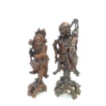 2x Carved oriental figures Tallest 43 cm