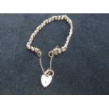 9ct Gold gate bracelet with safety chain & heart s