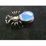 Silver pin brooch set with possibly moon stone in