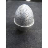 Early white metal pin cushion in the form of an eg