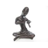 Bronze figure of a man playing the flute Height 23