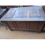 Large oak chest with 3 carved top panels