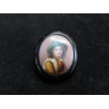 Whitby jet hand painted tyrolean boy brooch