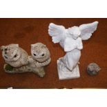 Stone owl statue together with 2 others