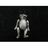 White metal articulating bear pin cushion