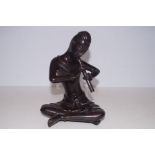 Cold painted bronze figure of a man playing the fl