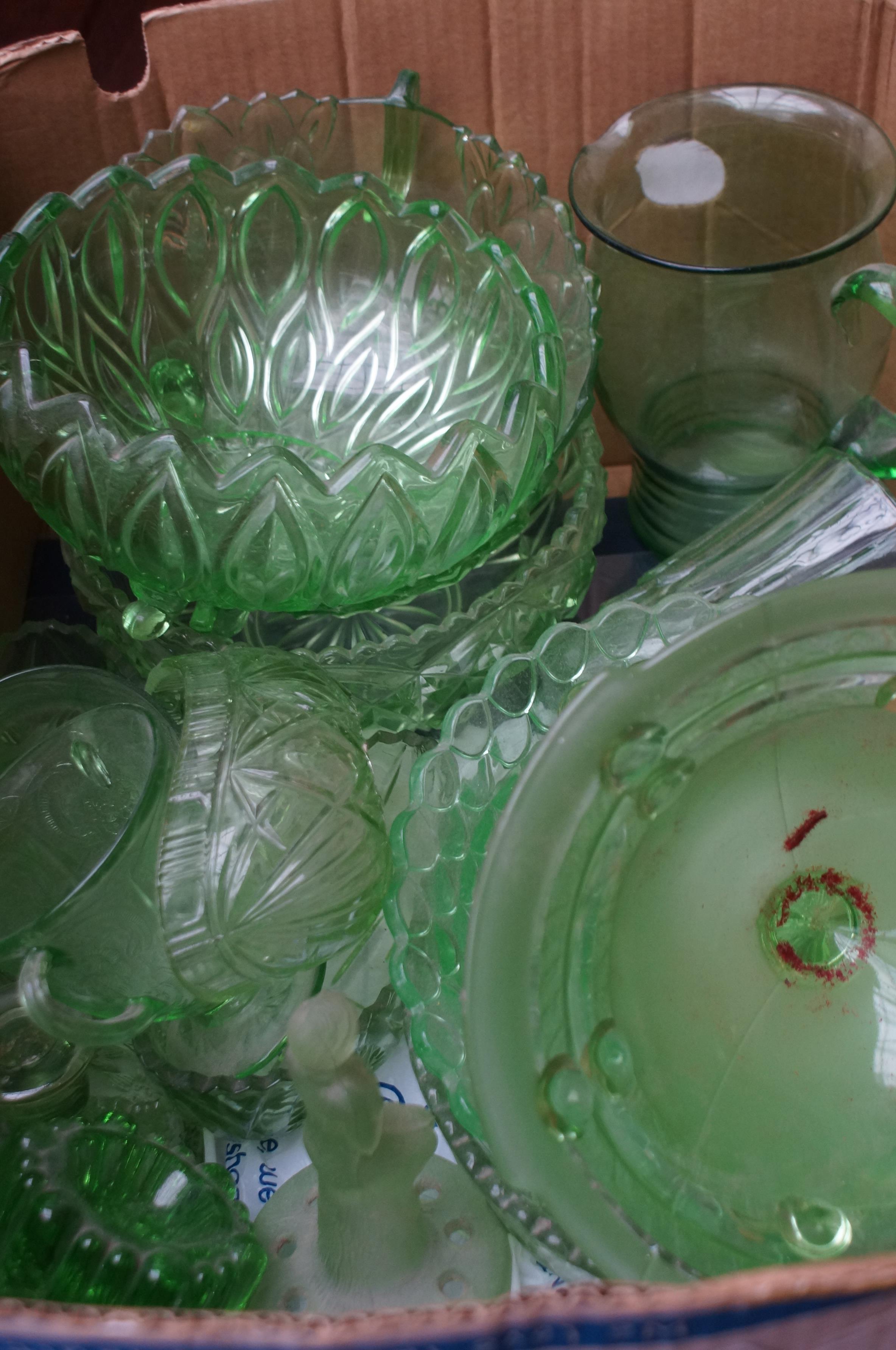 Large box of green glass ware