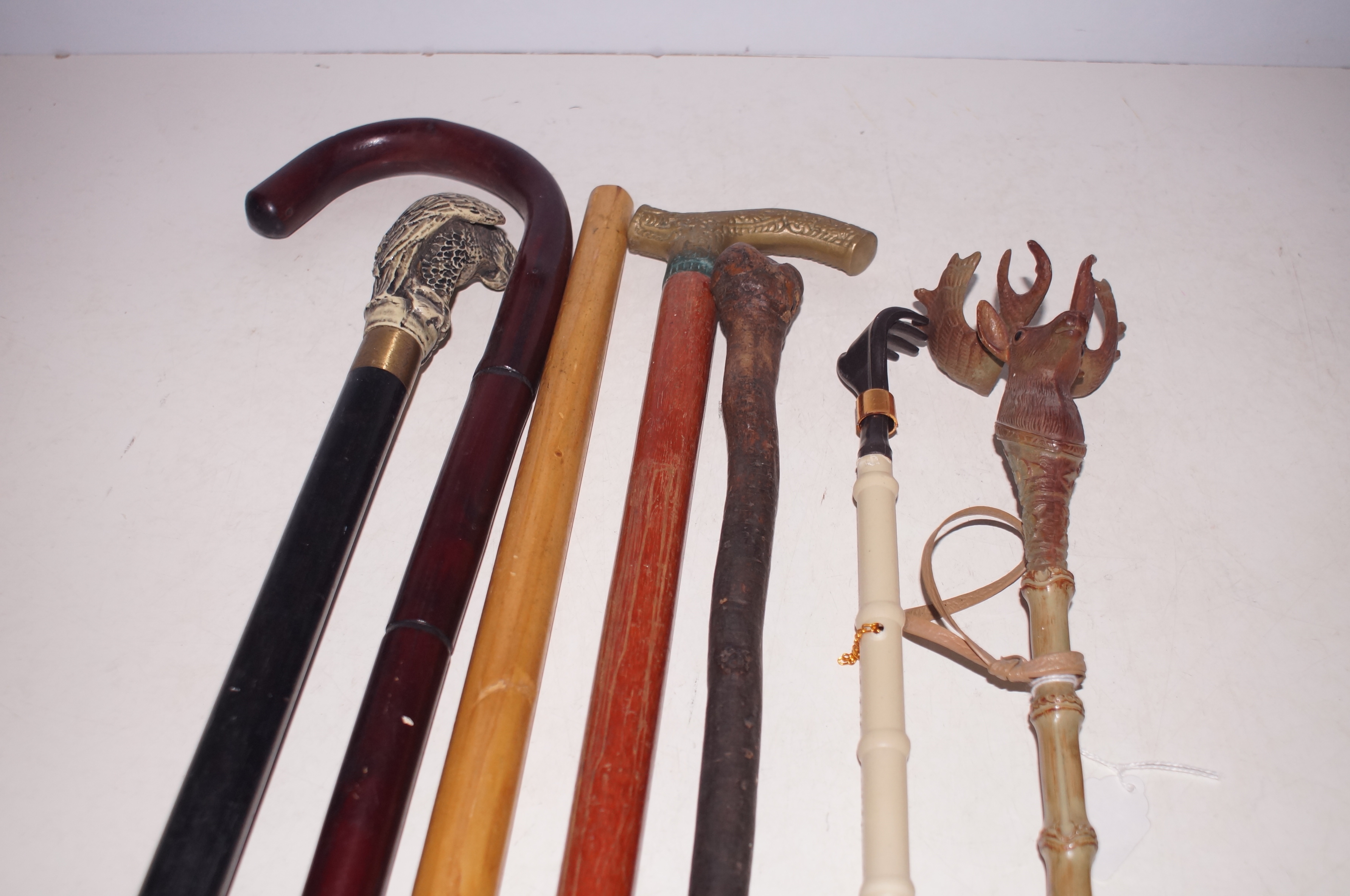 Collection of walking sticks & crops