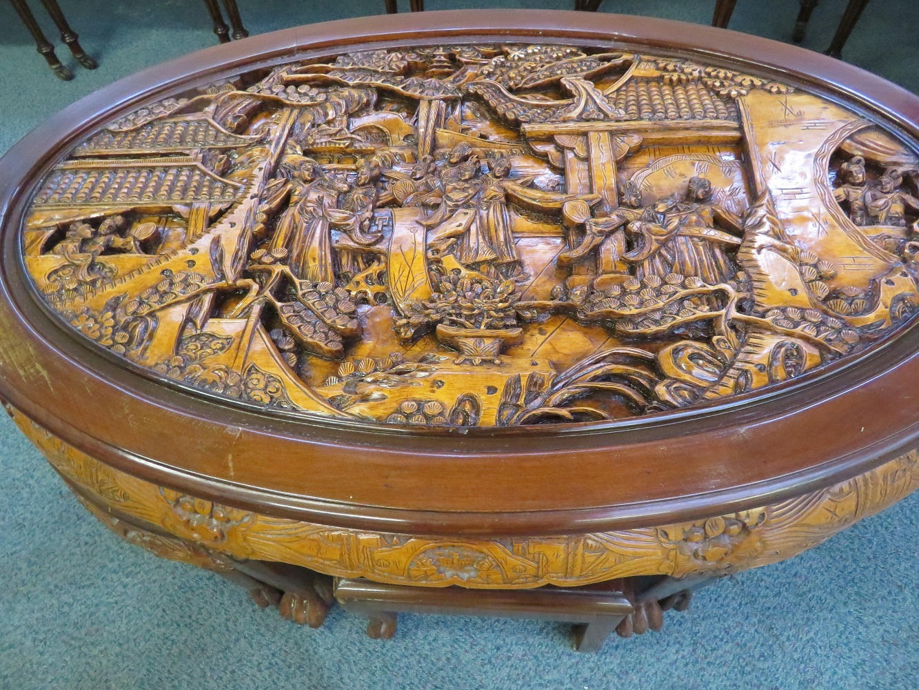 Finely carved Chinese table, raised on claw feet w