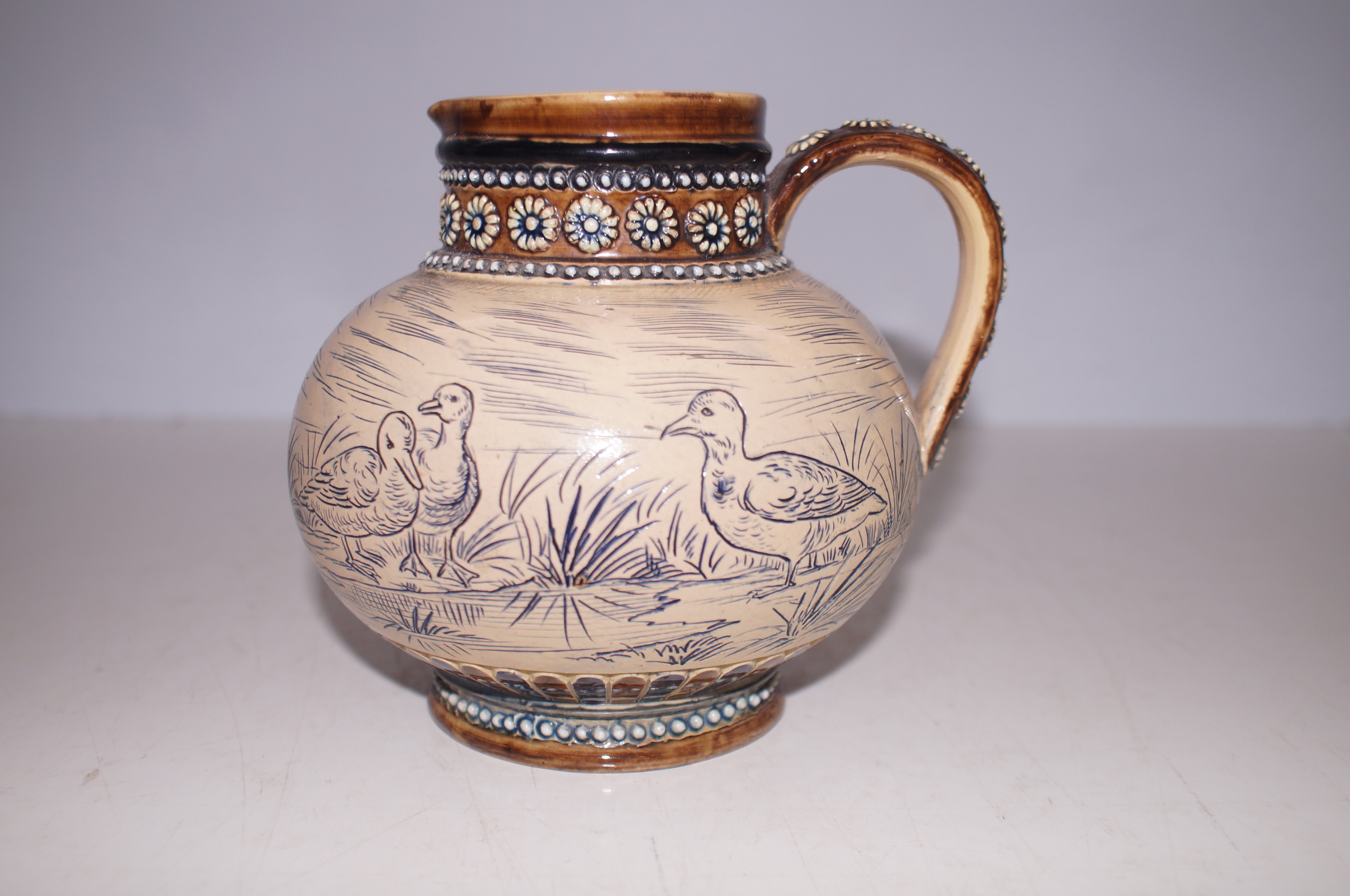 Early 20th century jug depicting birds. Unsigned,