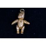 Yellow metal articulating charm teddy