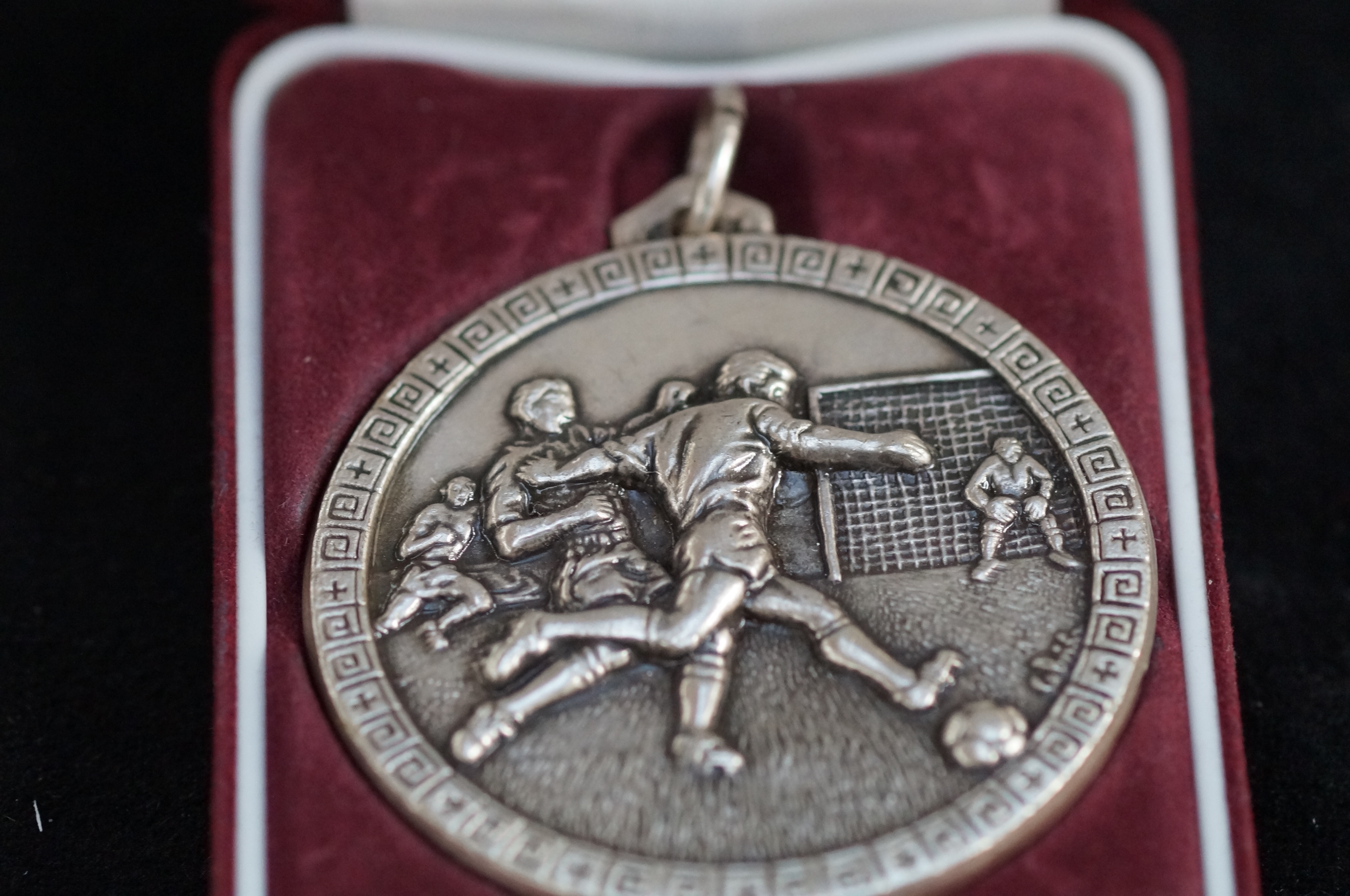 Cased football medal