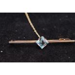 9ct Gold pin brooch set with central topaz with sa