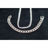 Silver curb chain together with a silver curb brac