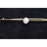 9ct Gold pin brooch set with central opal