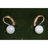 Pair of 14ct Gold earrings set with jade