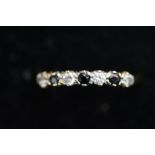 9ct Gold ring set with 4 white & 3 black stones Si