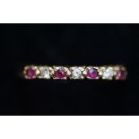 9ct Gold ring set with rubies & diamond Size M