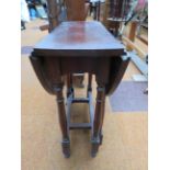 Small drop leaf table on casters