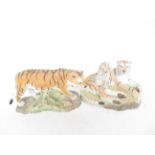 Pair of Sherratt & Simpson resin tiger figures