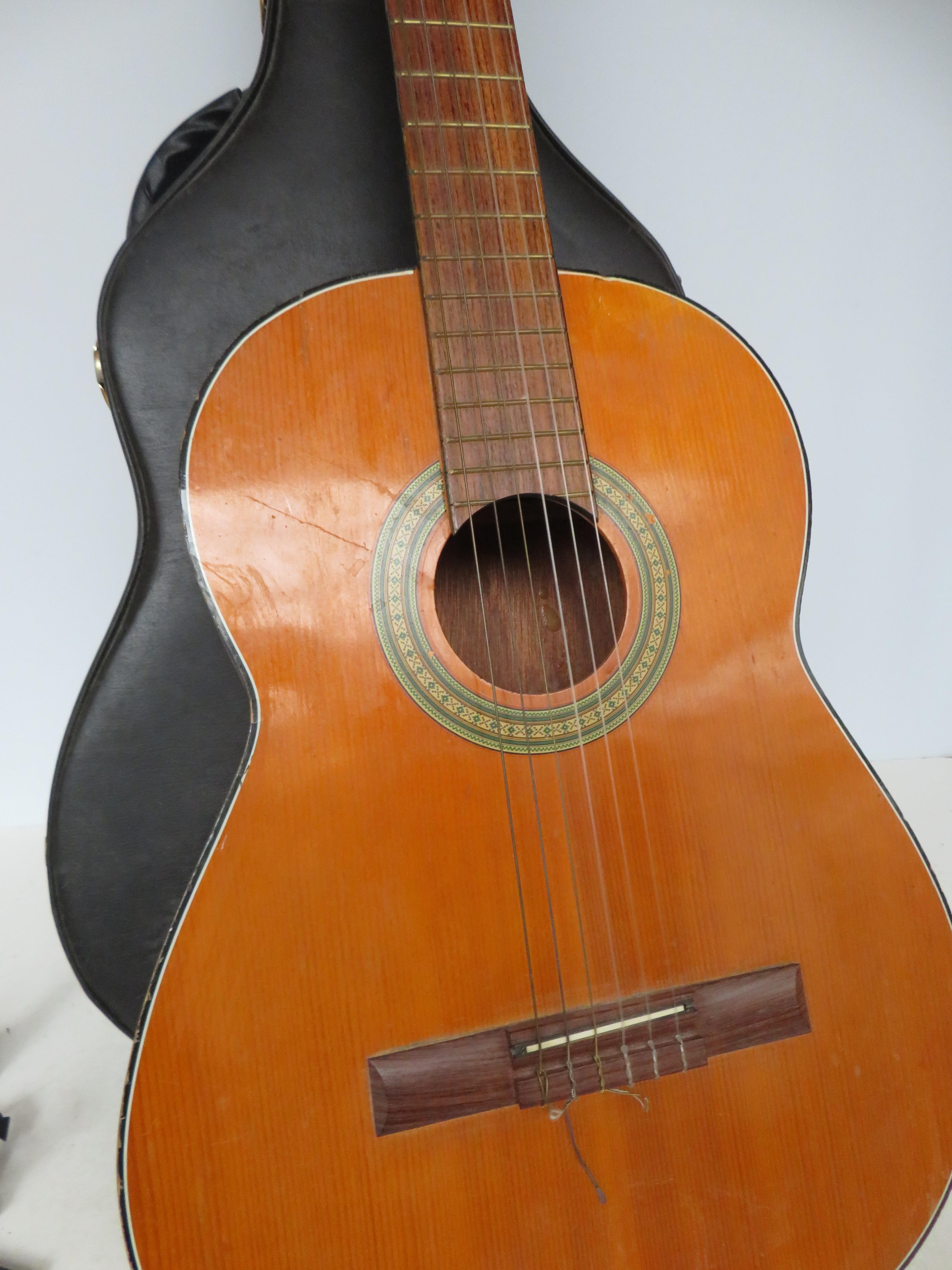 Acoustic guitar with hard fitted case