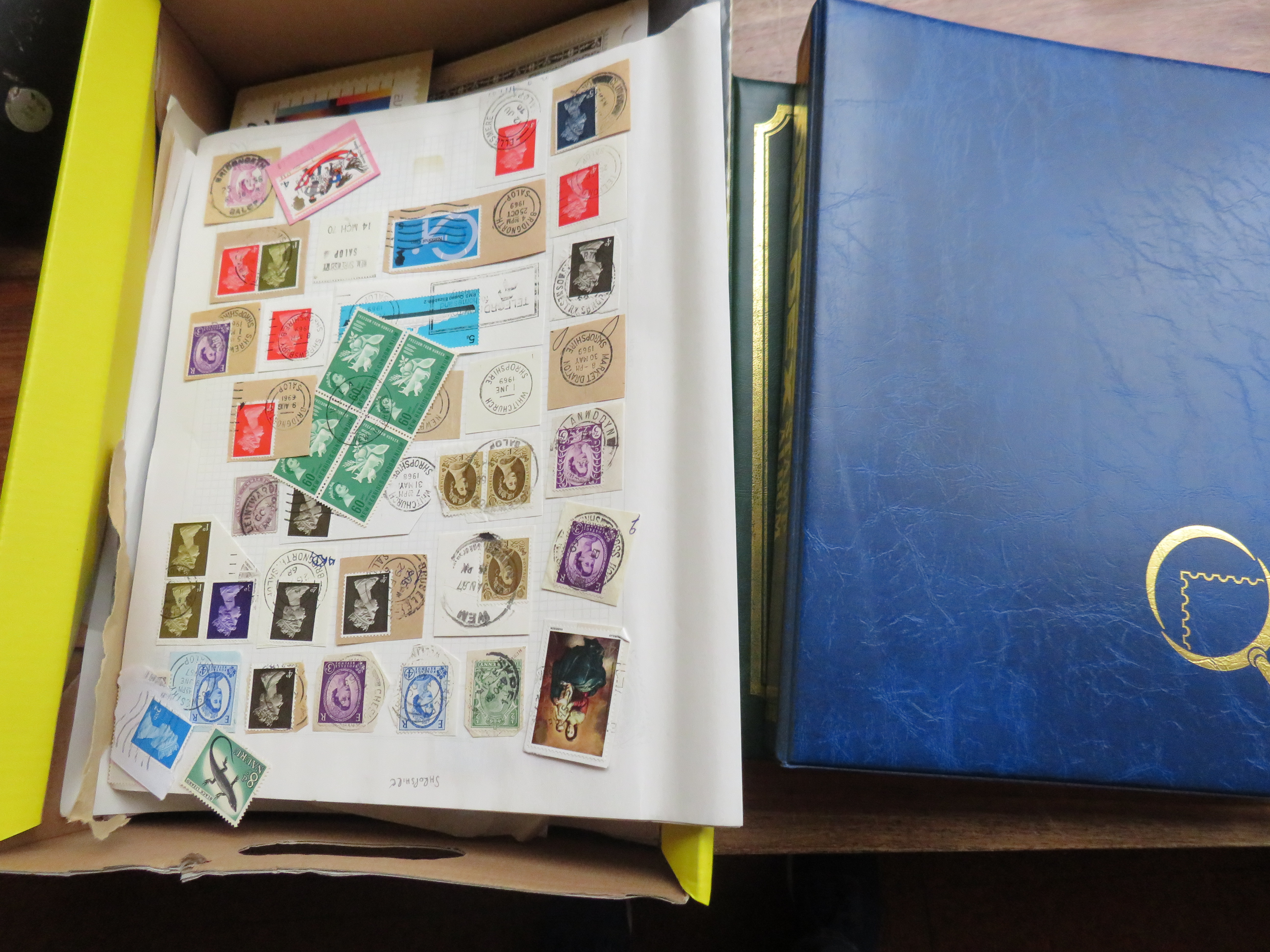 Box of stamps together with 2 vacant stamp albums