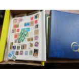 Box of stamps together with 2 vacant stamp albums