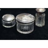 3 Silver topped vanity jars