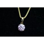 14ct Gold pendant with pink gem stone suspended on