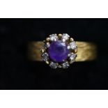 18ct Gold ring set with 7 diamonds & central ameth