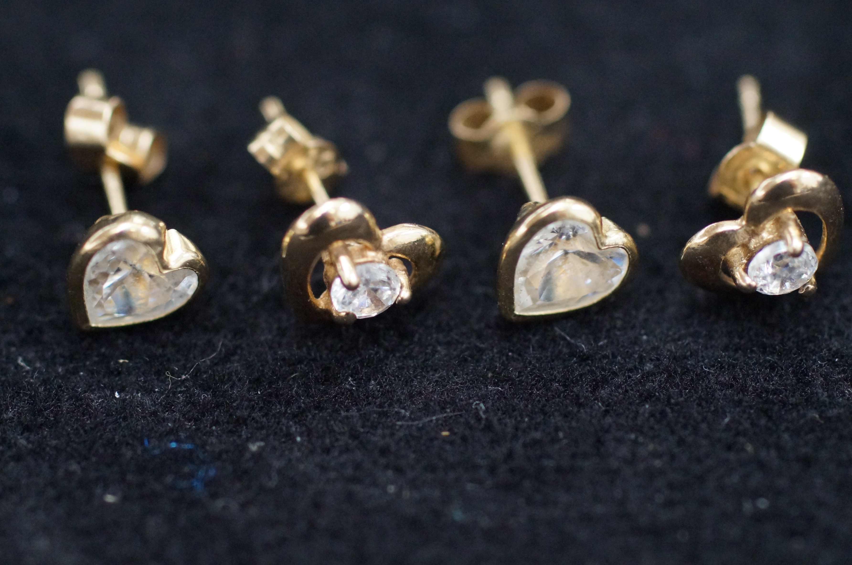 2x Pairs of 9ct gold earrings set with white stone